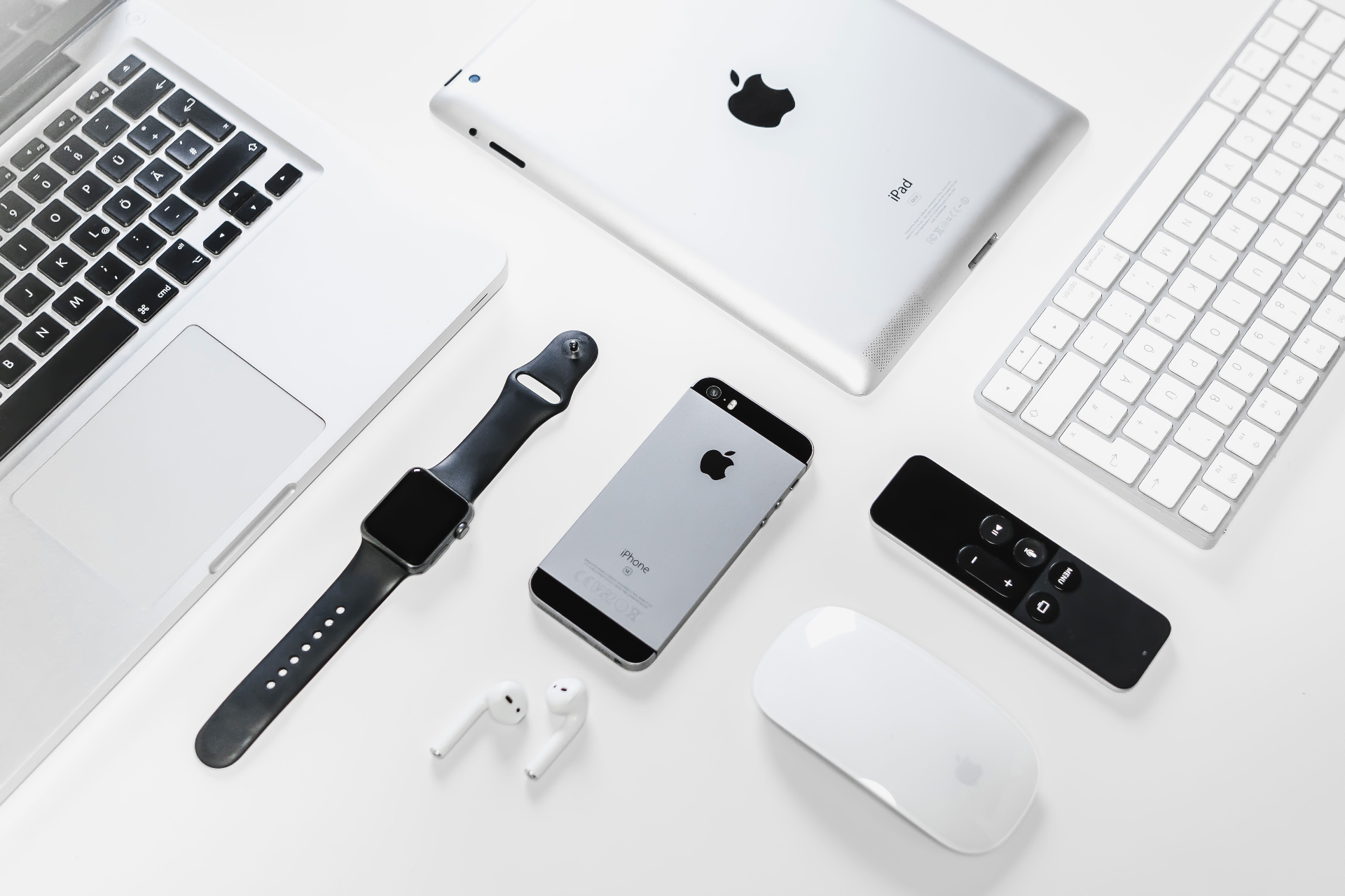Apple devices including MacBook, iPad, iPhone, and Apple Watch